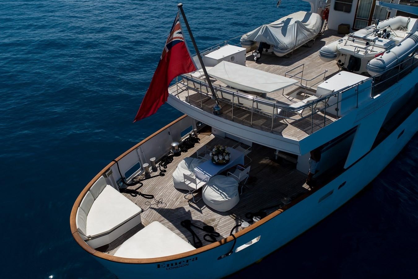 a boat with a flag on it aboard EMERA Yacht for Sale