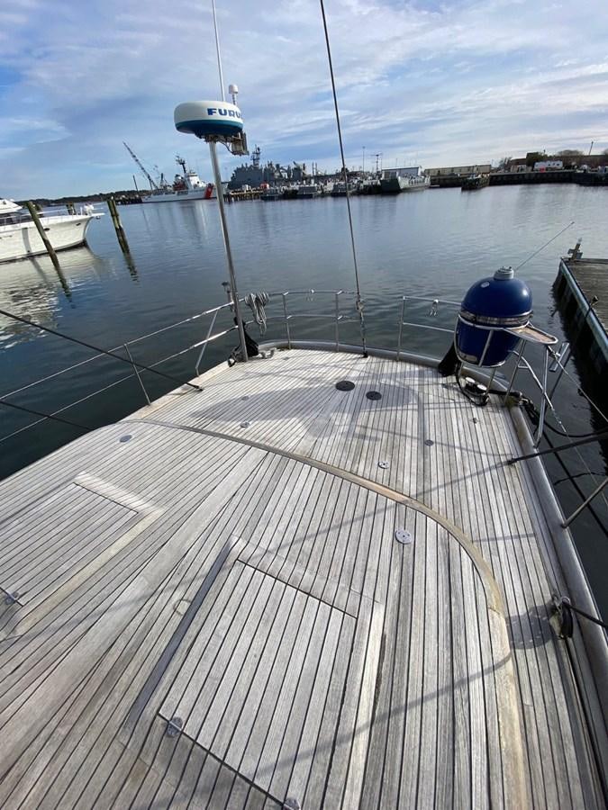 a deck with a boat on it aboard LAUREN L Yacht for Sale