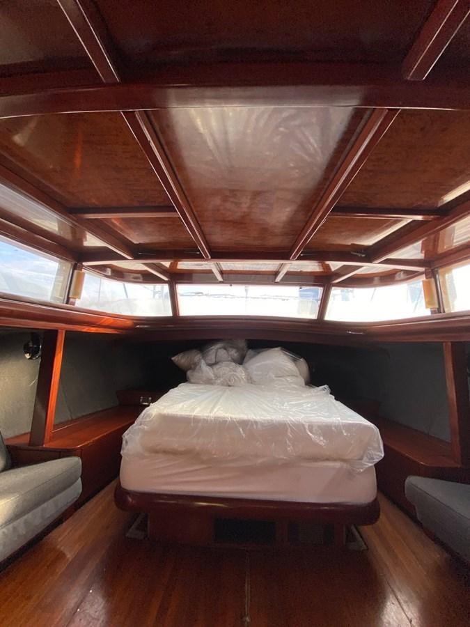 a bed in a room aboard LAUREN L Yacht for Sale