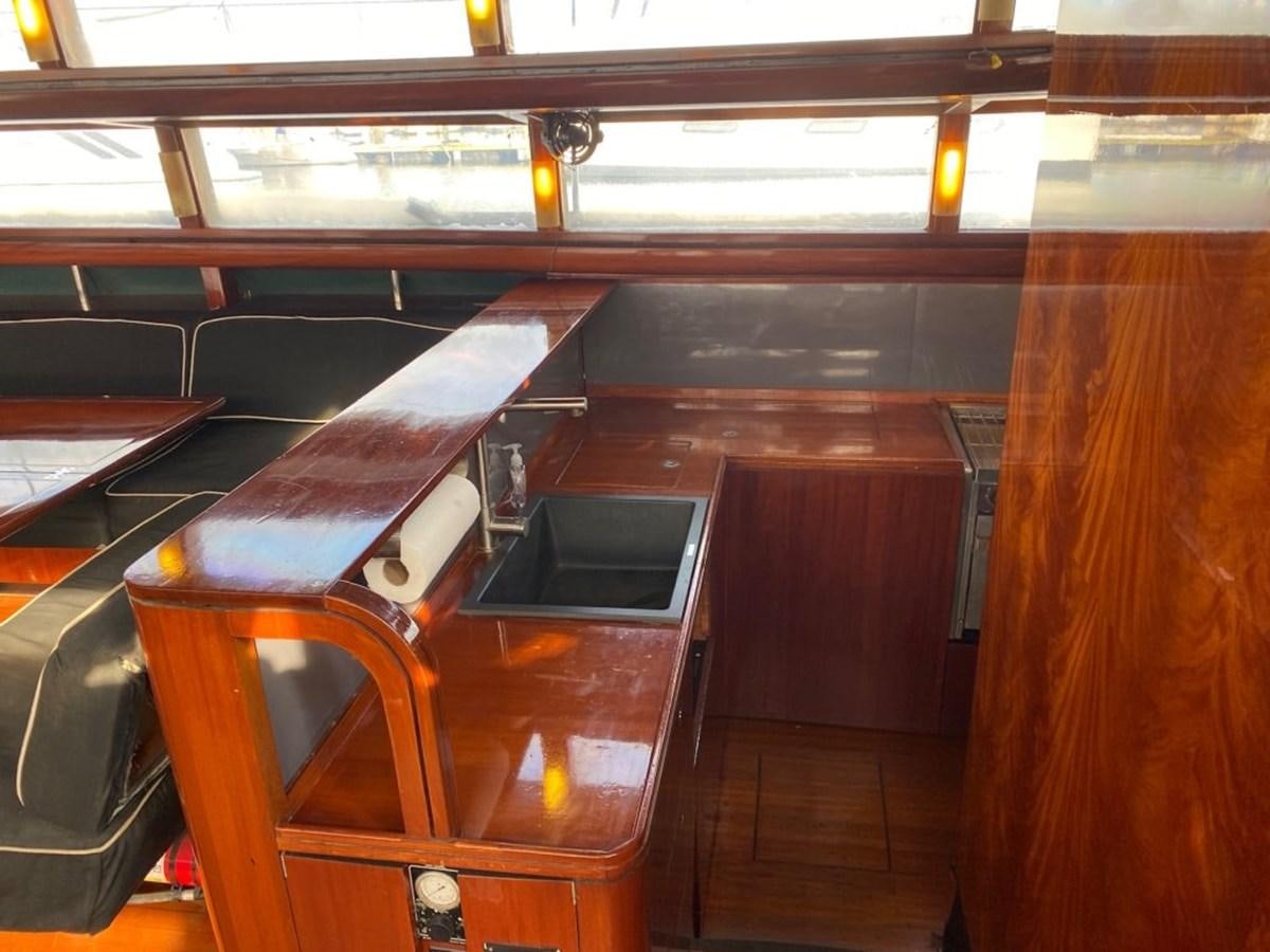 a table with a laptop on it aboard LAUREN L Yacht for Sale