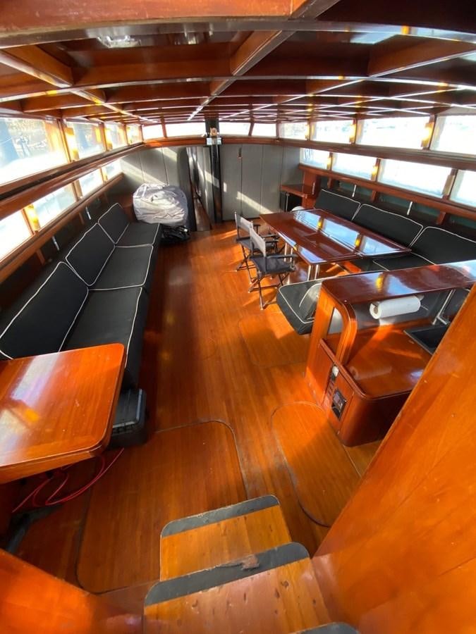 a room with desks and chairs aboard LAUREN L Yacht for Sale