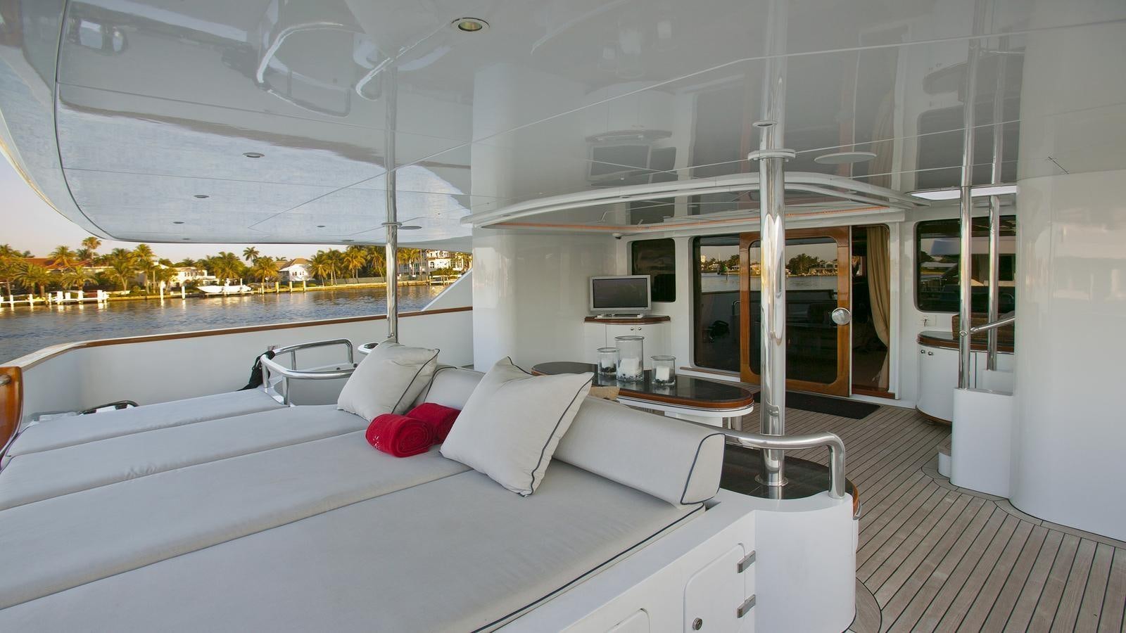a room with a bed and a table aboard IL SOLE Yacht for Sale