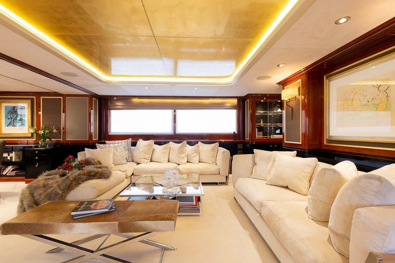 a living room with a large window aboard IL SOLE Yacht for Sale