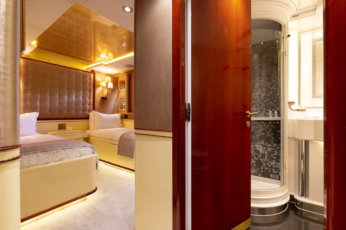 a room with a bed and a mirror aboard IL SOLE Yacht for Sale