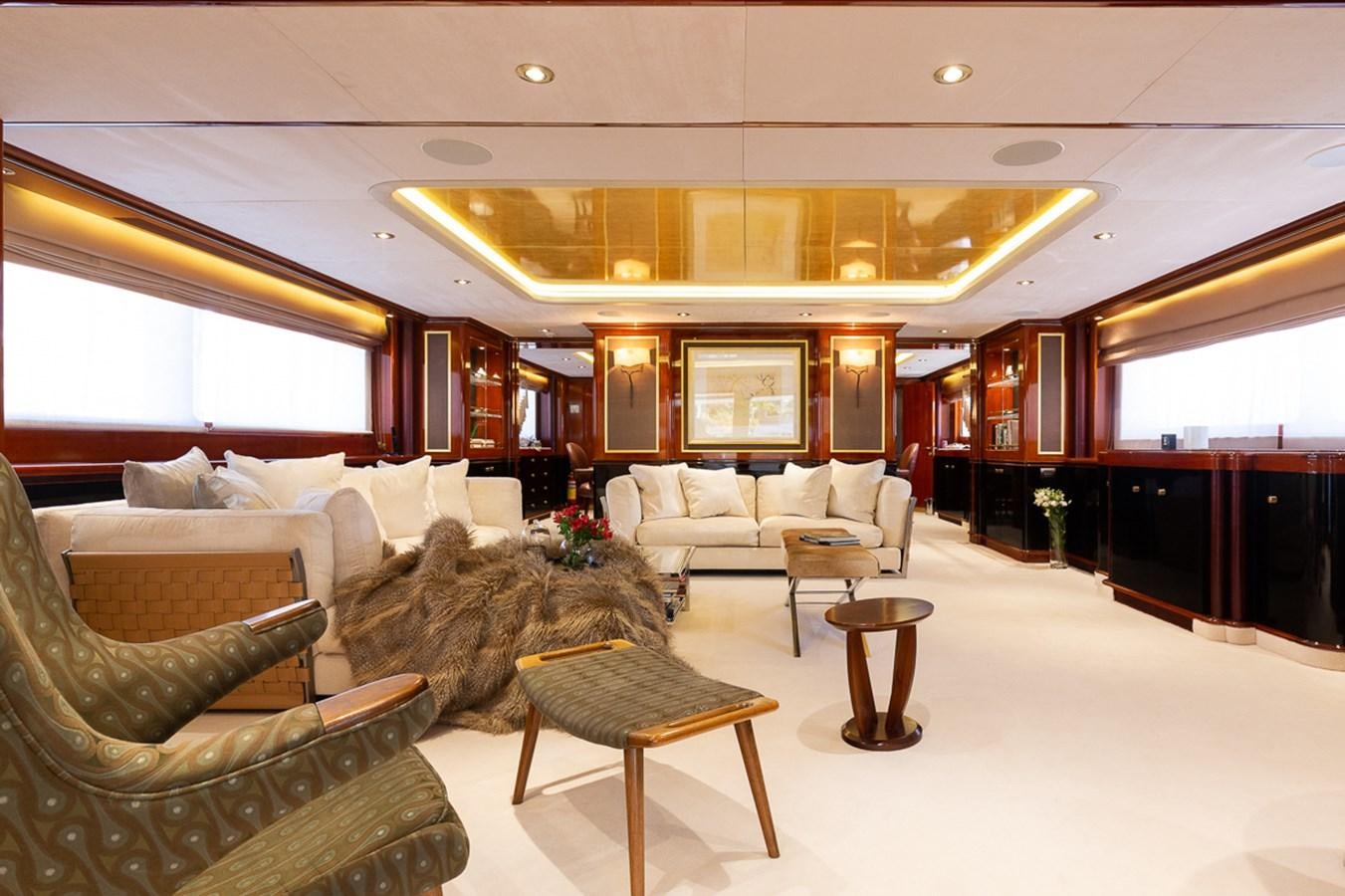 a large living room with a large chandelier aboard IL SOLE Yacht for Sale