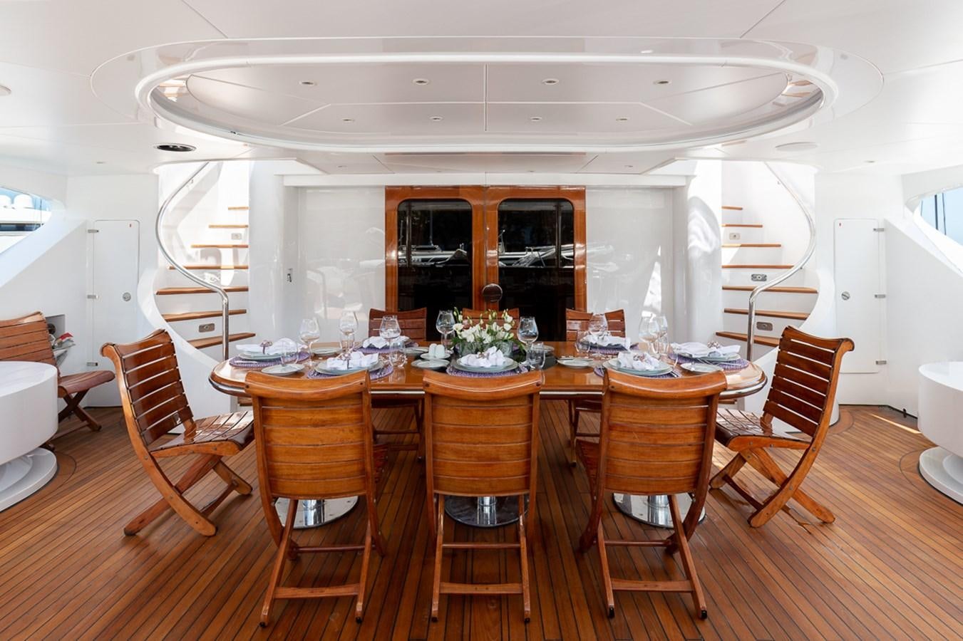 a dining room with chairs and a table aboard IL SOLE Yacht for Sale