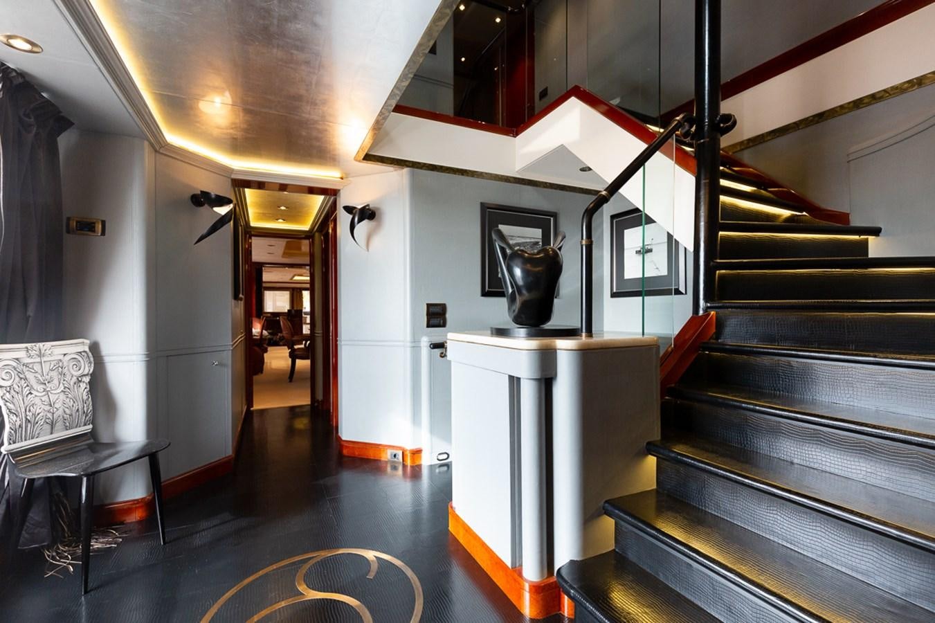 a room with a table and chairs aboard IL SOLE Yacht for Sale