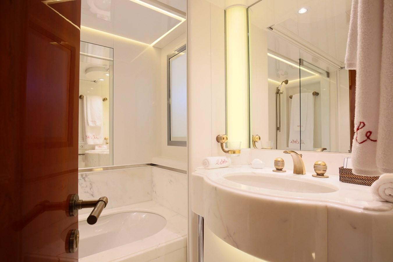 a bathroom with a sink and a mirror aboard IL SOLE Yacht for Sale