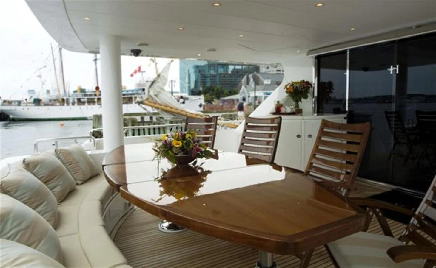 a room with a table and chairs aboard SEA LEGEND Yacht for Sale