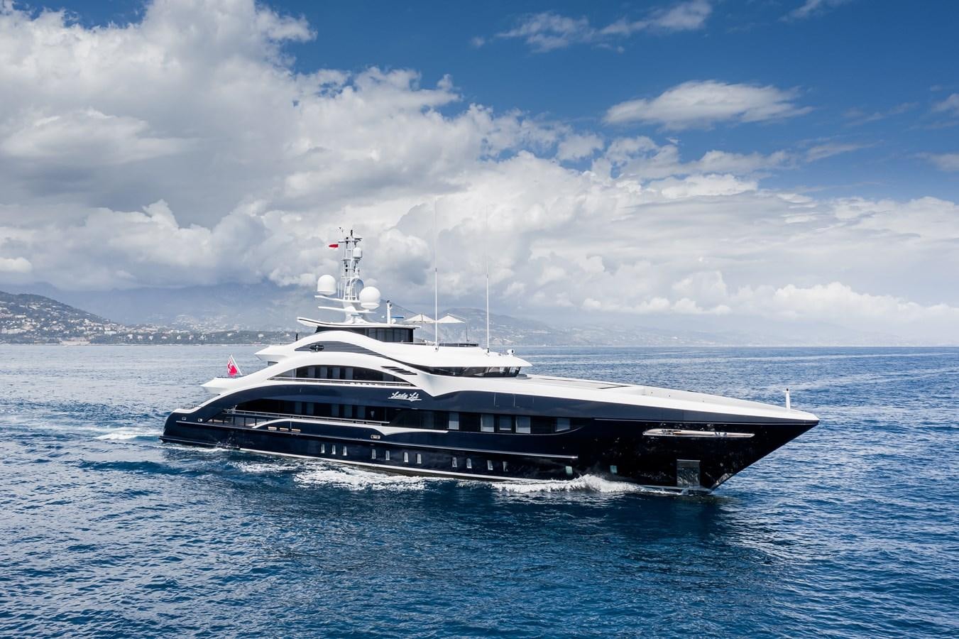 a large ship in the water aboard JULIA Yacht for Sale