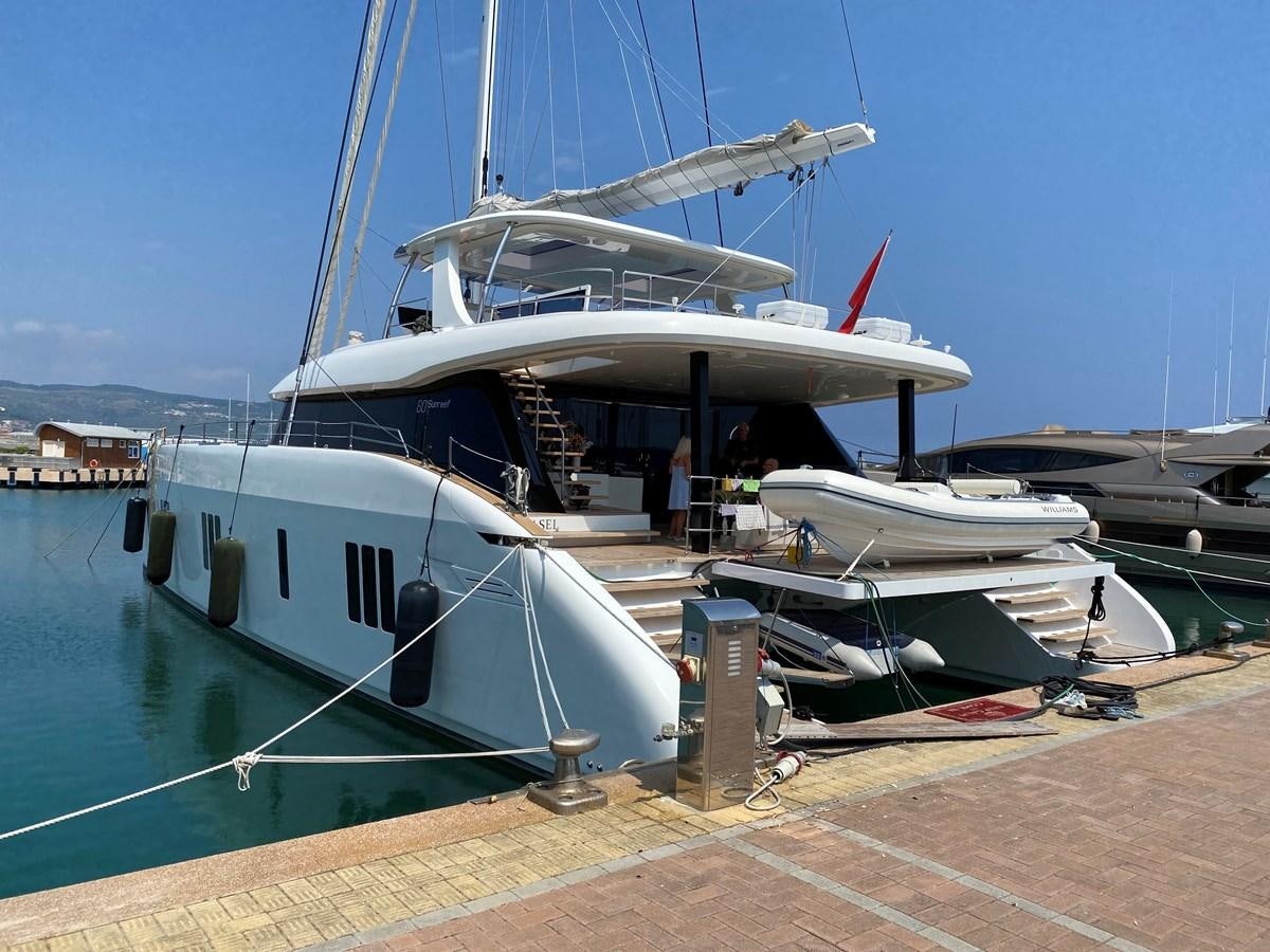 a boat docked at a pier aboard GIJA Yacht for Sale