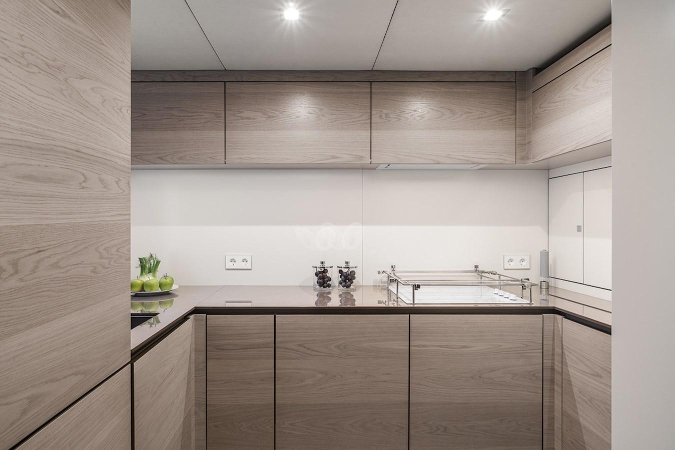 a kitchen with a sink and cabinets aboard GIJA Yacht for Sale
