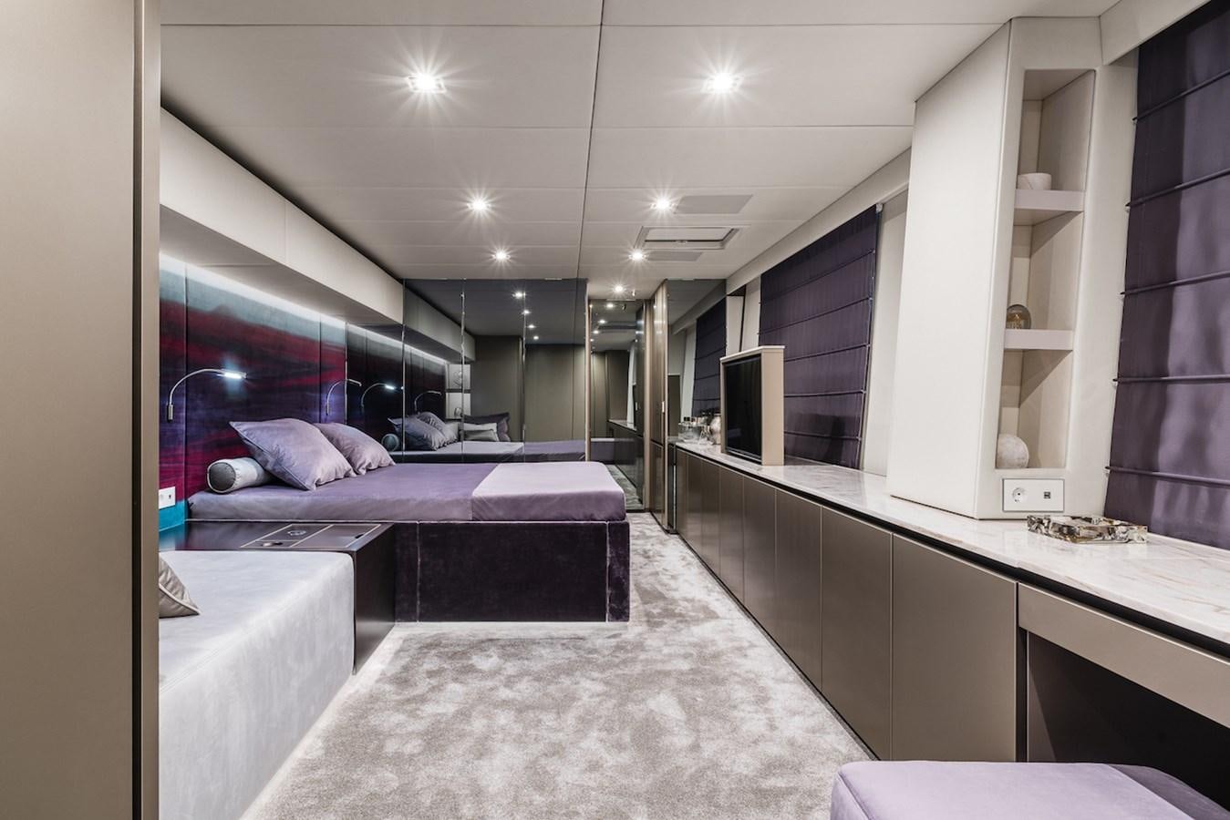 a room with a bed and a desk aboard GIJA Yacht for Sale
