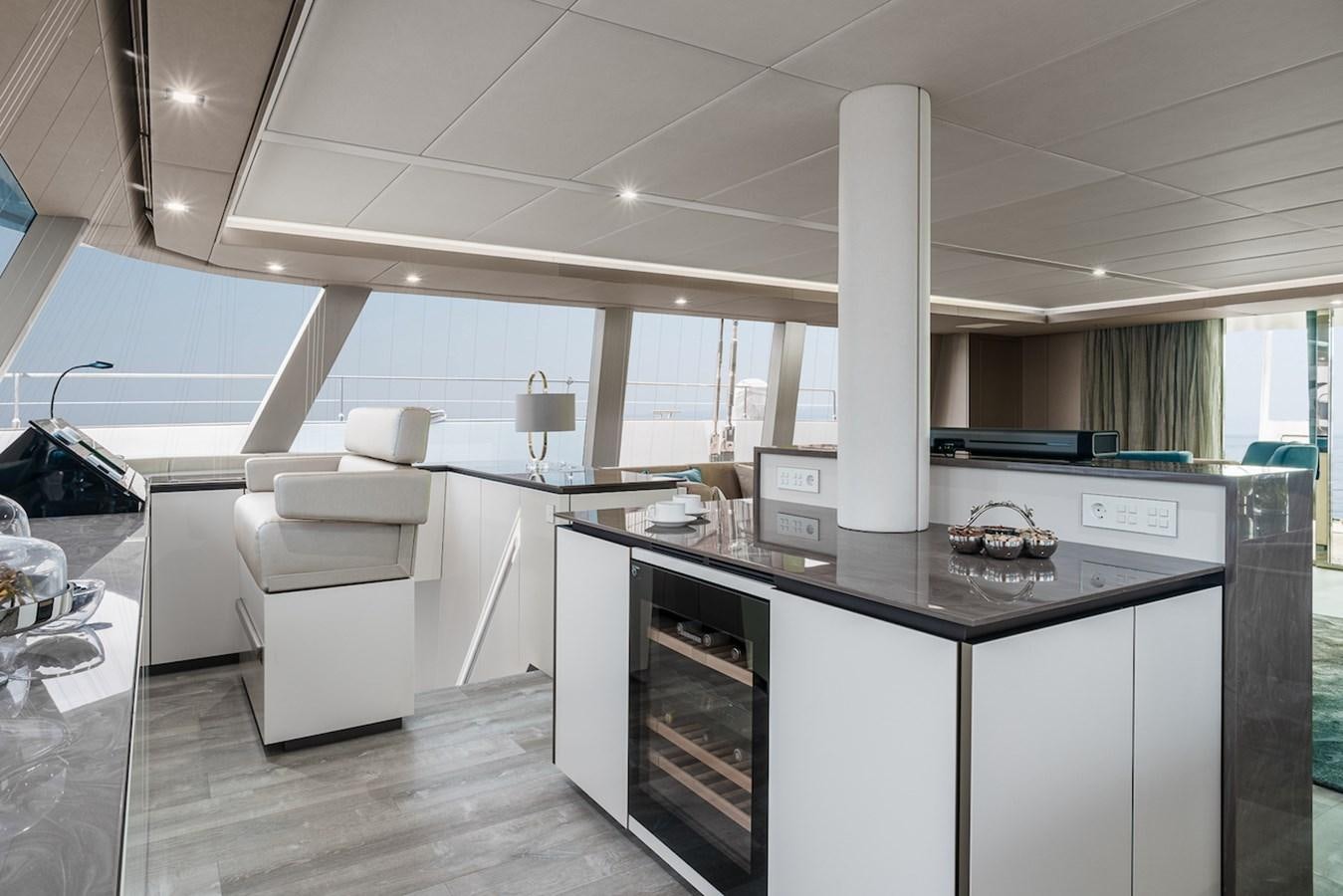 a kitchen with white cabinets aboard GIJA Yacht for Sale