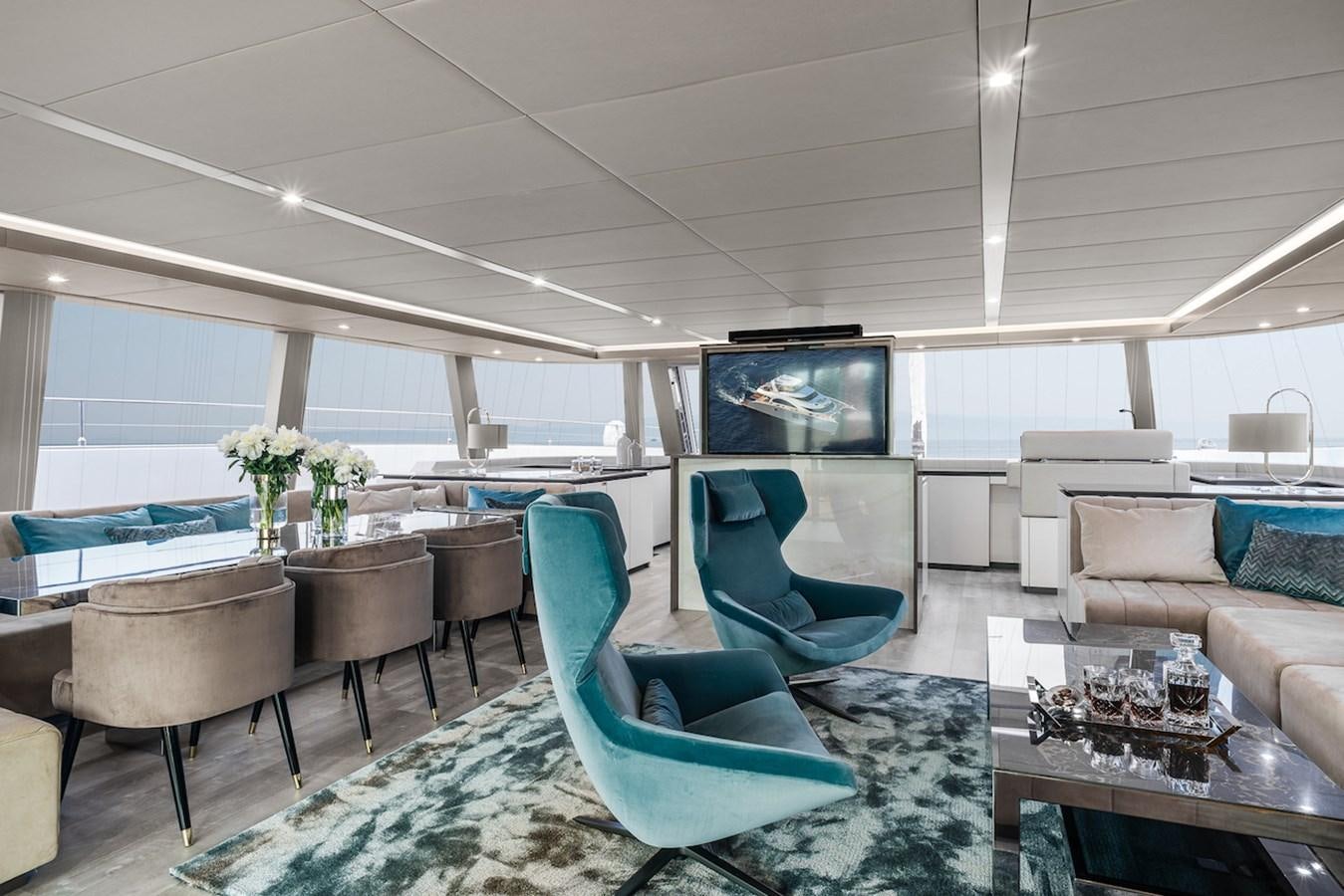 a room with a couch and a television aboard GIJA Yacht for Sale