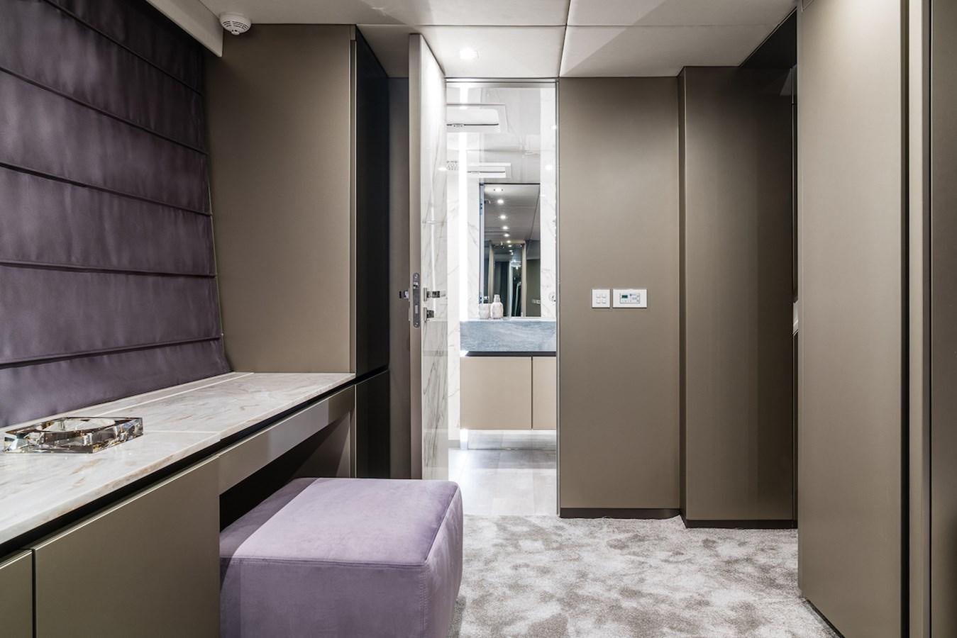 a room with a desk and a bed aboard GIJA Yacht for Sale