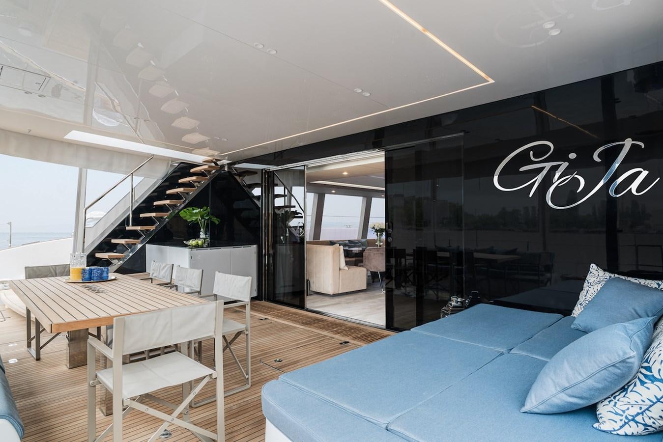 a modern looking room with a pool table and chairs aboard GIJA Yacht for Sale