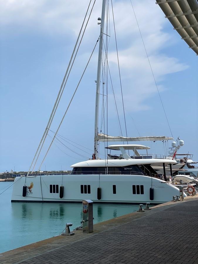 a large white boat in a harbor aboard GIJA Yacht for Sale