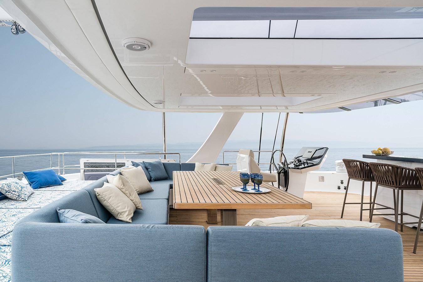 a living room with a couch and a table aboard GIJA Yacht for Sale