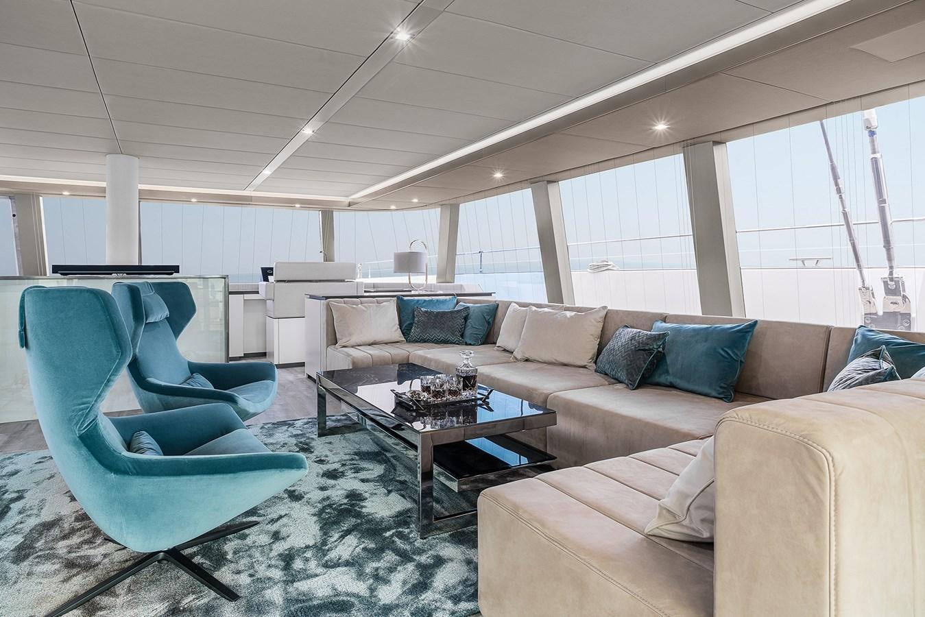 a living room with a couch and a coffee table aboard GIJA Yacht for Sale