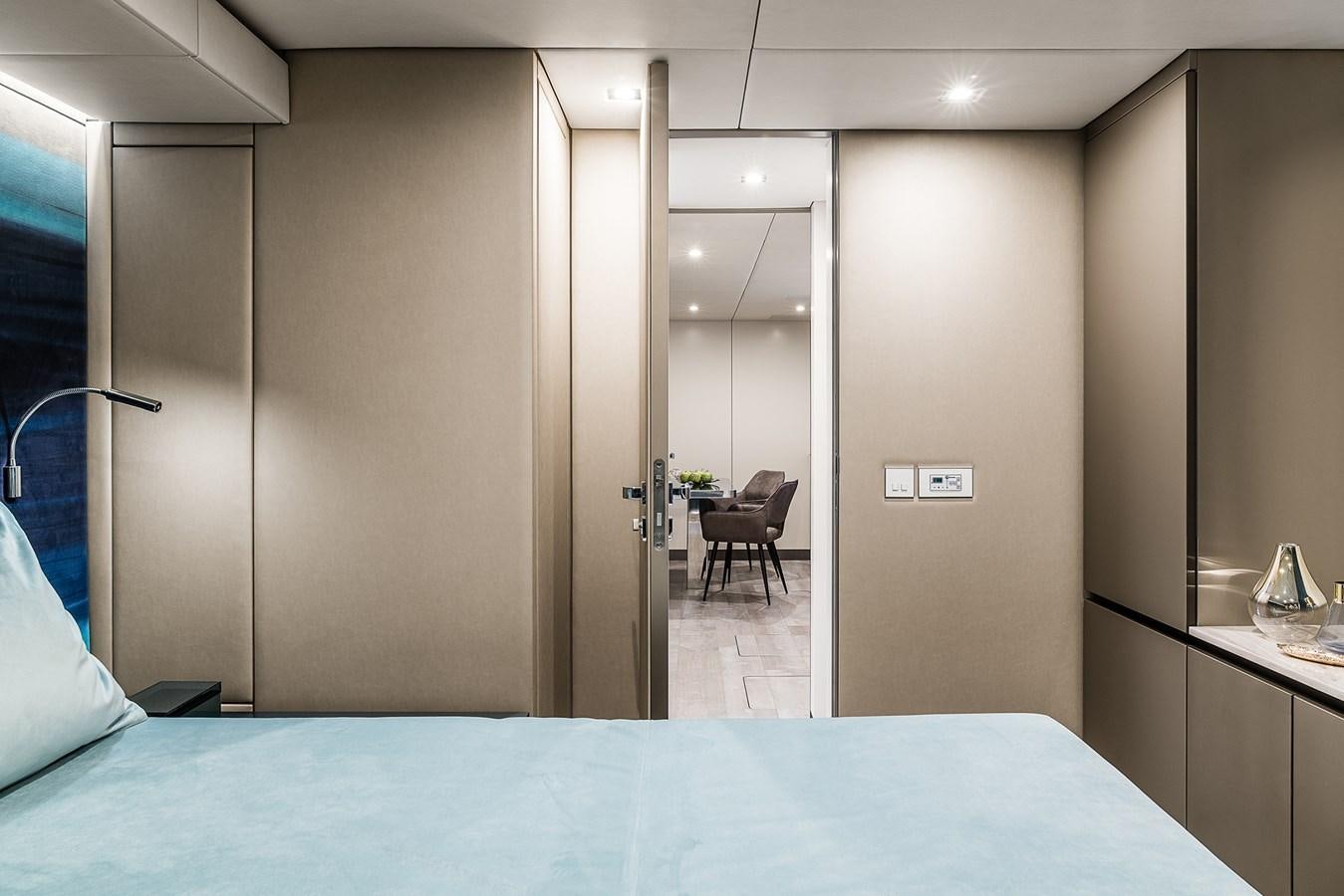 a room with a chair and a table aboard GIJA Yacht for Sale