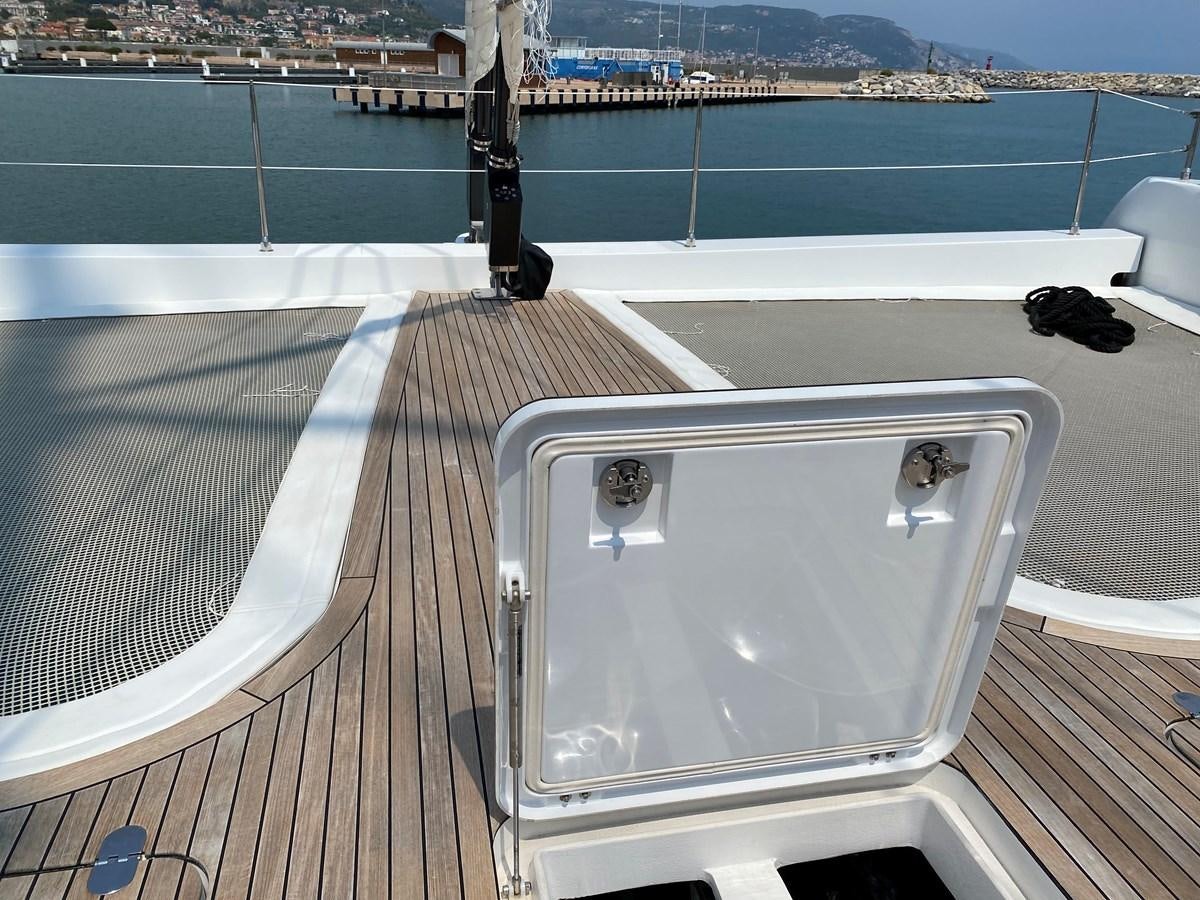 a white rectangular object on a deck overlooking a body of water aboard GIJA Yacht for Sale