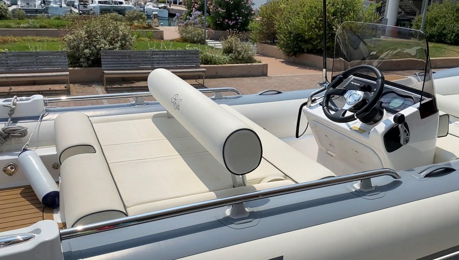 a white convertible car aboard GIJA Yacht for Sale