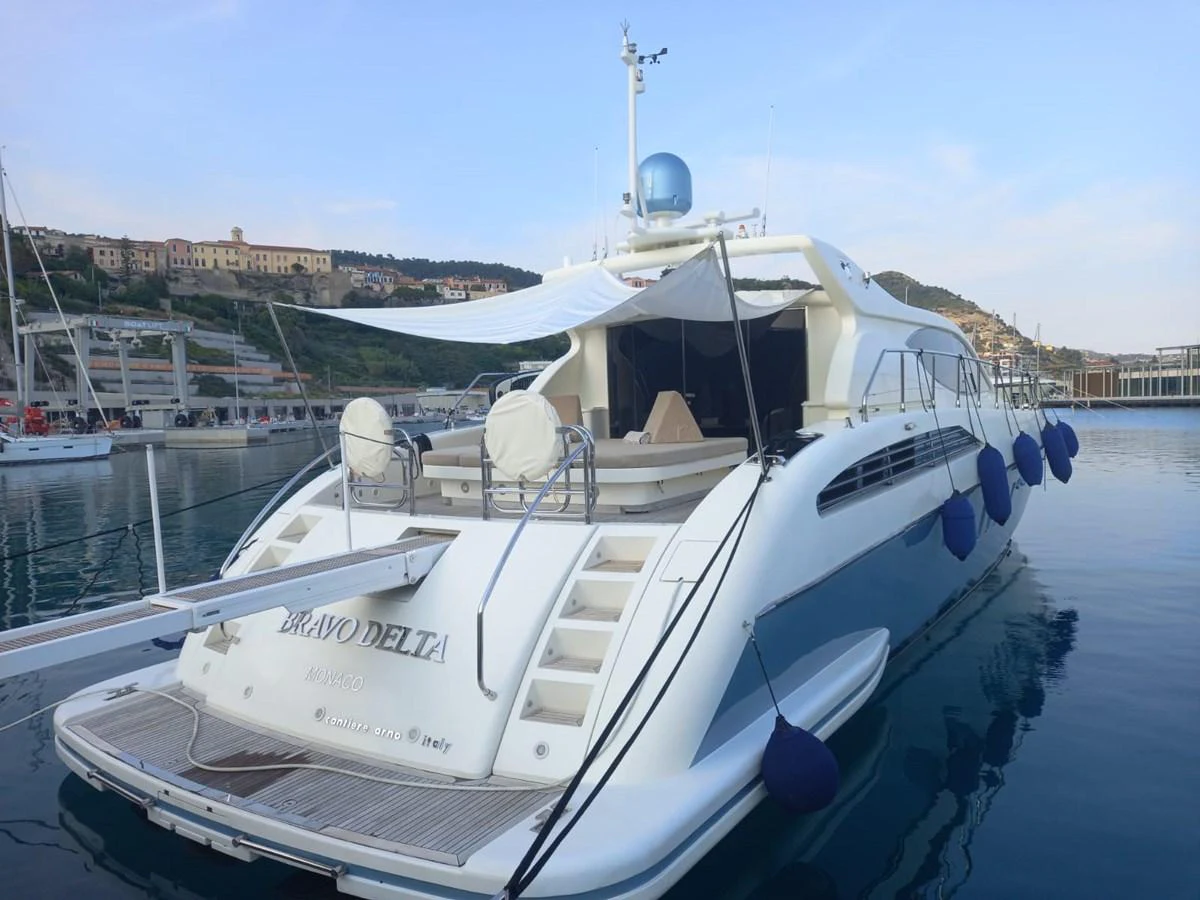 a boat docked at a pier aboard BRAVO DELTA Yacht for Sale