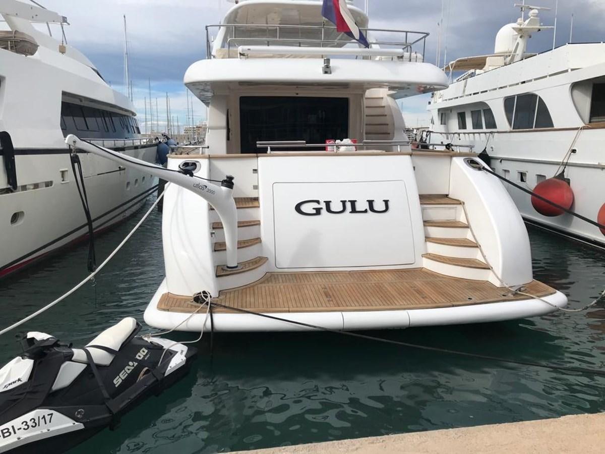 a boat docked at a pier aboard GULU Yacht for Sale