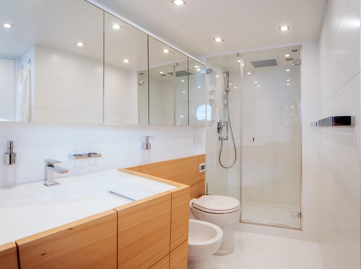 a bathroom with a large mirror aboard GULU Yacht for Sale