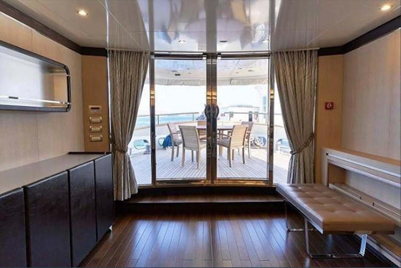 a room with a table and chairs aboard BLUE BERRY Yacht for Sale