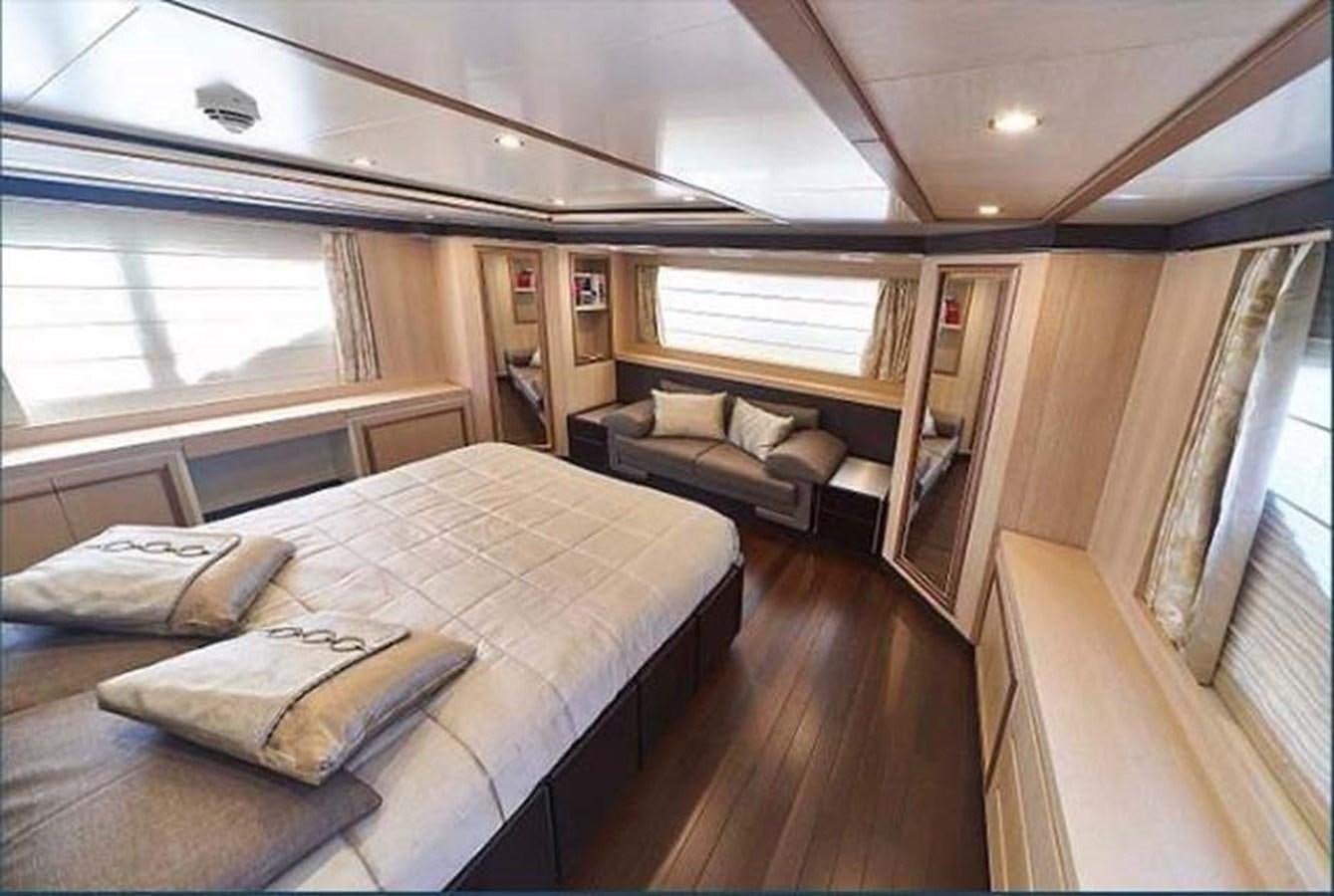 a room with a bed and a couch aboard BLUE BERRY Yacht for Sale