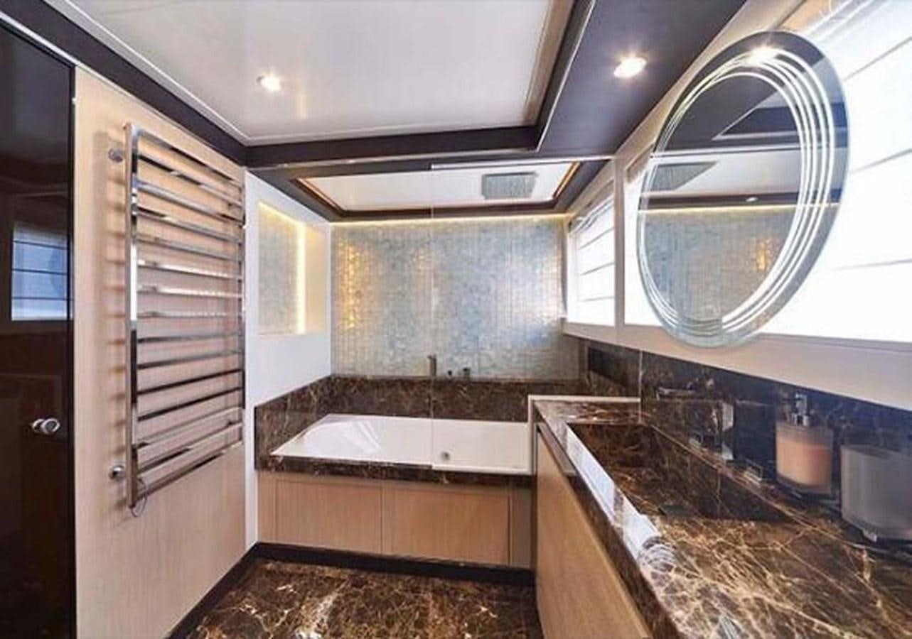 a large kitchen with a large round window aboard BLUE BERRY Yacht for Sale