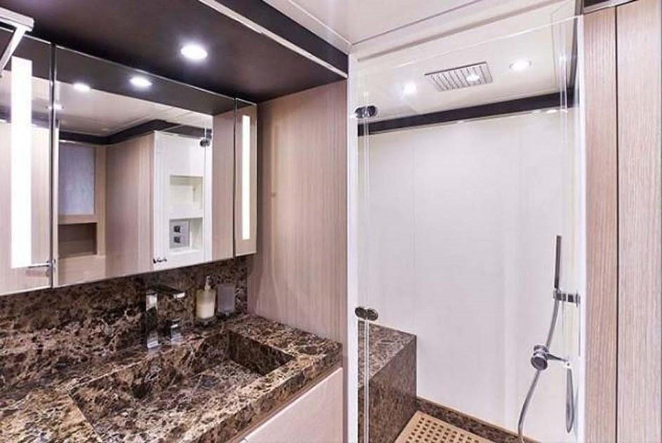 a bathroom with a countertop sink and cabinets aboard BLUE BERRY Yacht for Sale