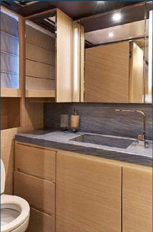 a bathroom with a sink and cabinets aboard BLUE BERRY Yacht for Sale