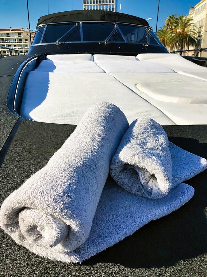 a car with a large whale statue aboard MAMBA Yacht for Sale