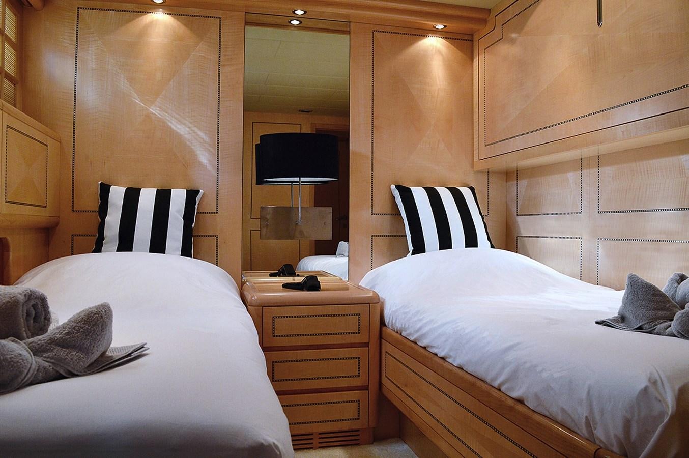 a room with two beds aboard MAMBA Yacht for Sale