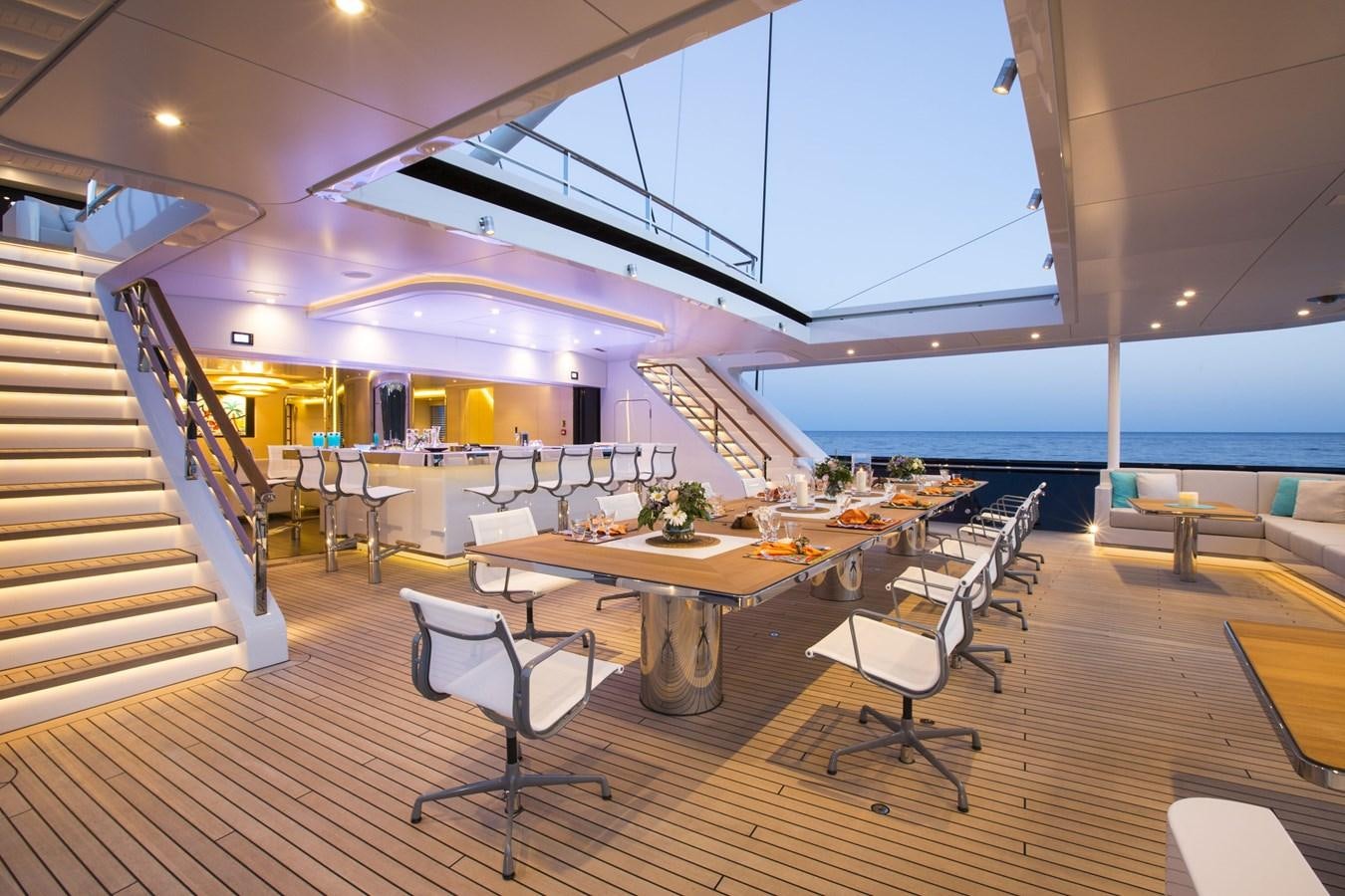 a room with tables and chairs aboard AQUIJO Yacht for Sale