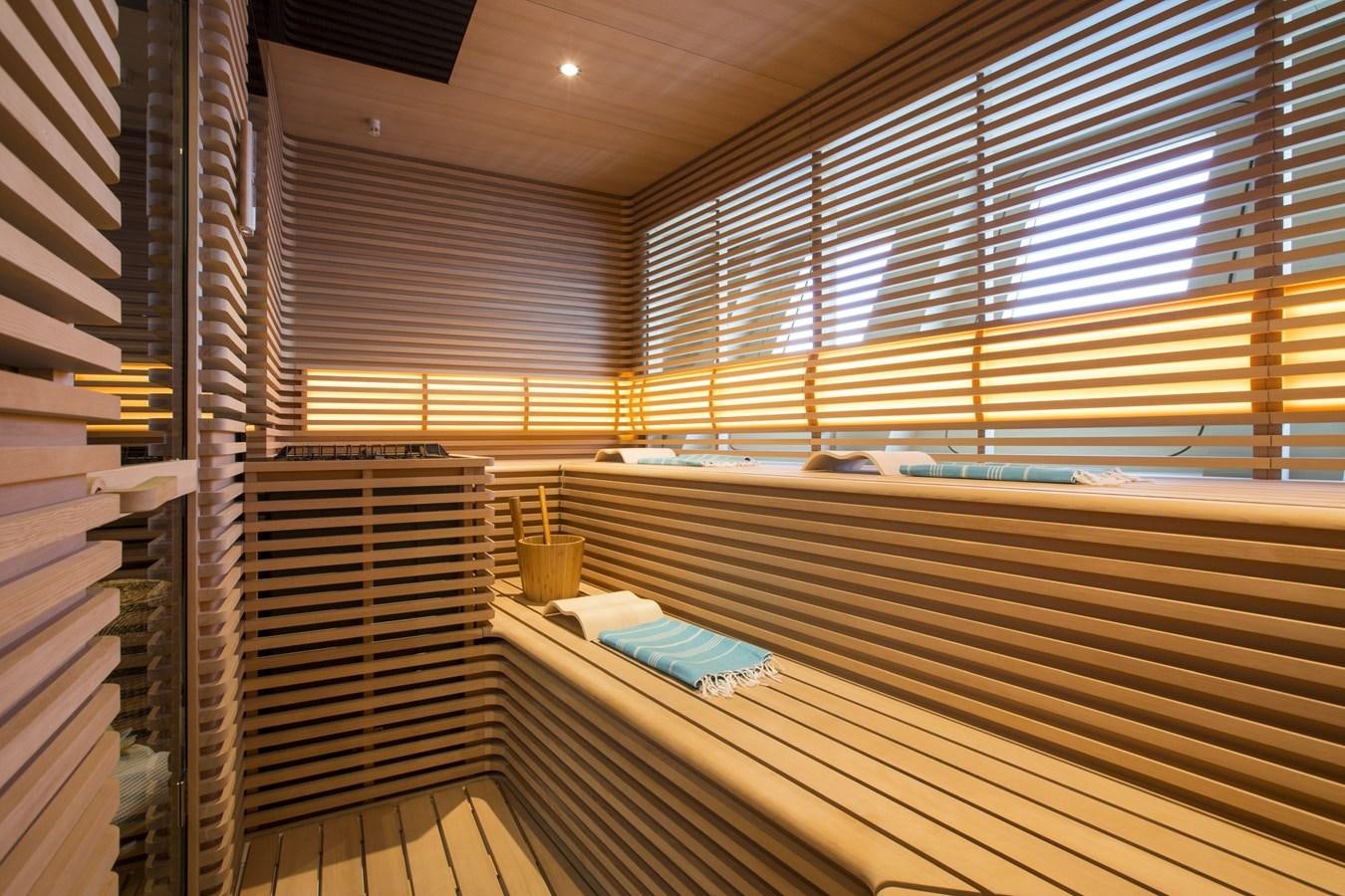 a room with a deck and a pool aboard AQUIJO Yacht for Sale