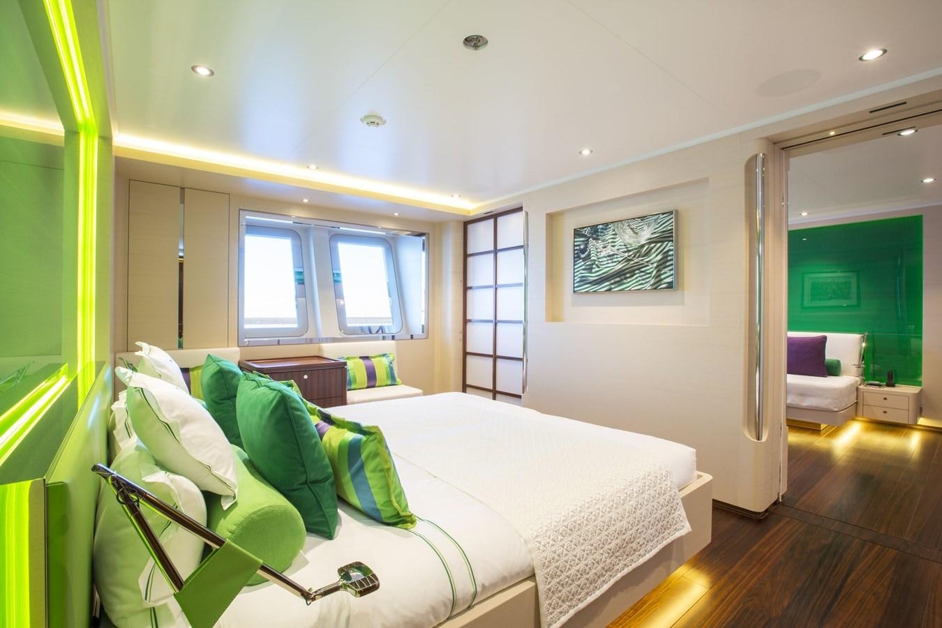 a bedroom with a bed and a mirror aboard AQUIJO Yacht for Sale