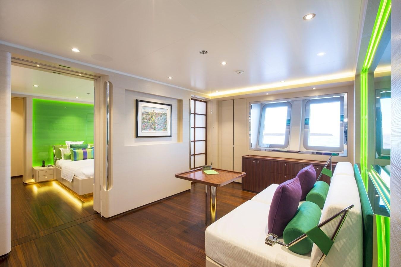 a room with a table and a bed aboard AQUIJO Yacht for Sale