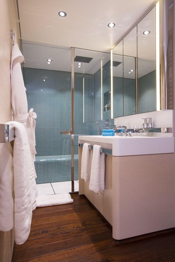 a bathroom with a glass shower aboard AQUIJO Yacht for Sale