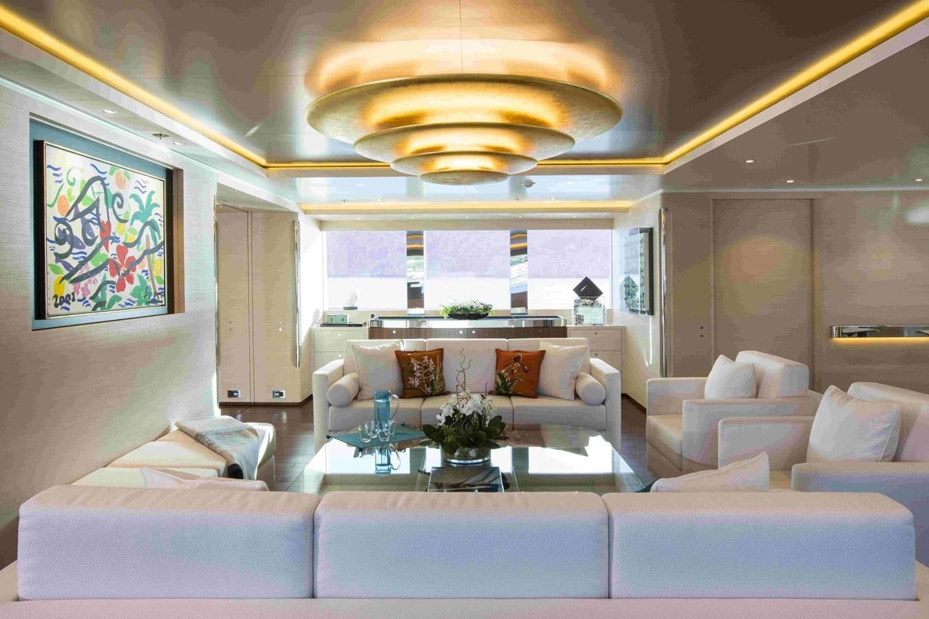 a living room with a large chandelier aboard AQUIJO Yacht for Sale