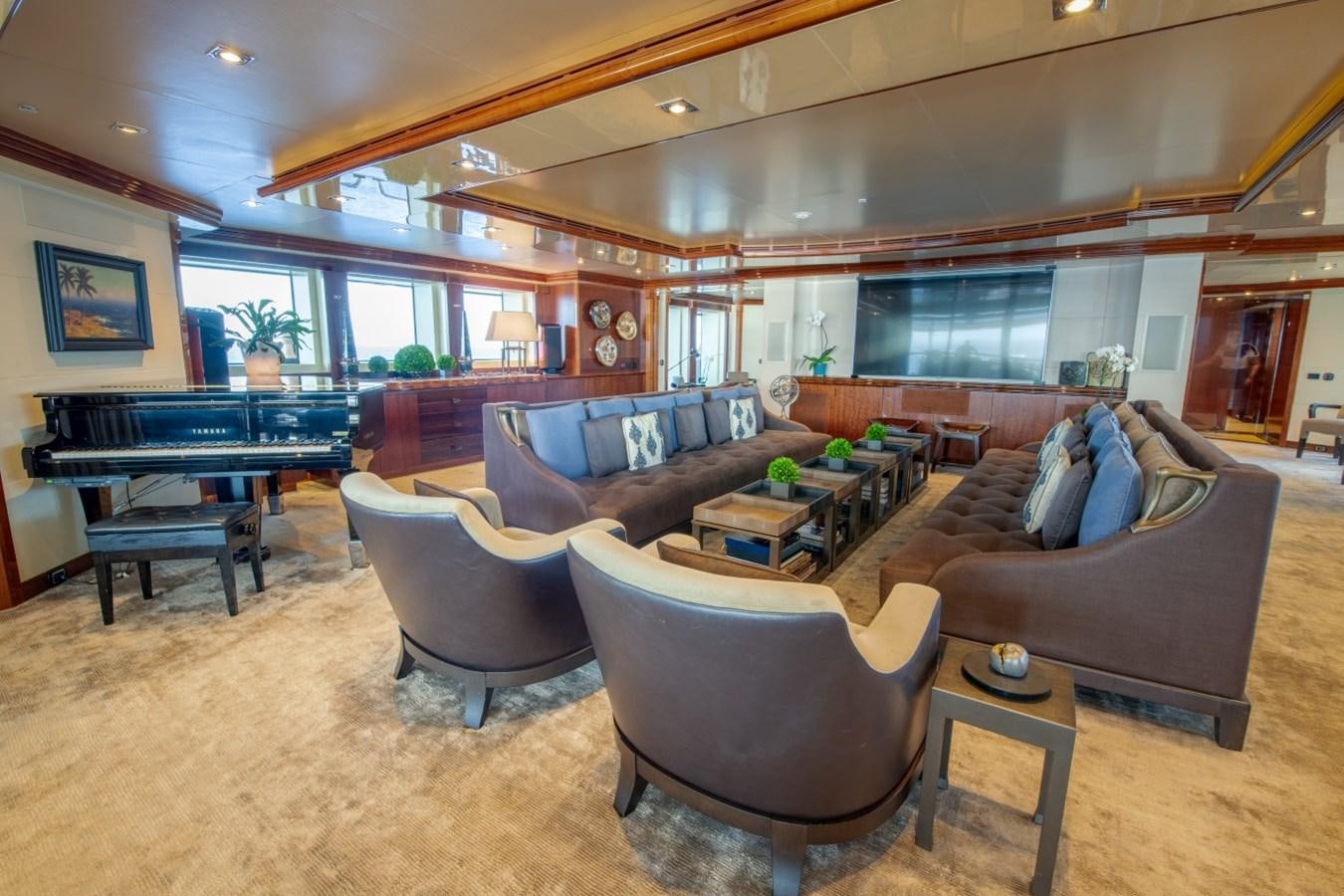 a living room with a couch and a table aboard ARBEMA Yacht for Charter