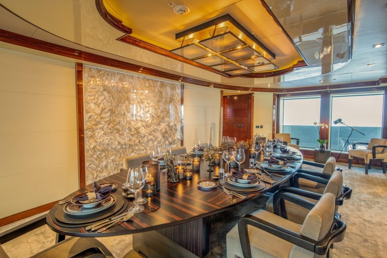 a large dining room with a large table and chairs aboard ARBEMA Yacht for Charter