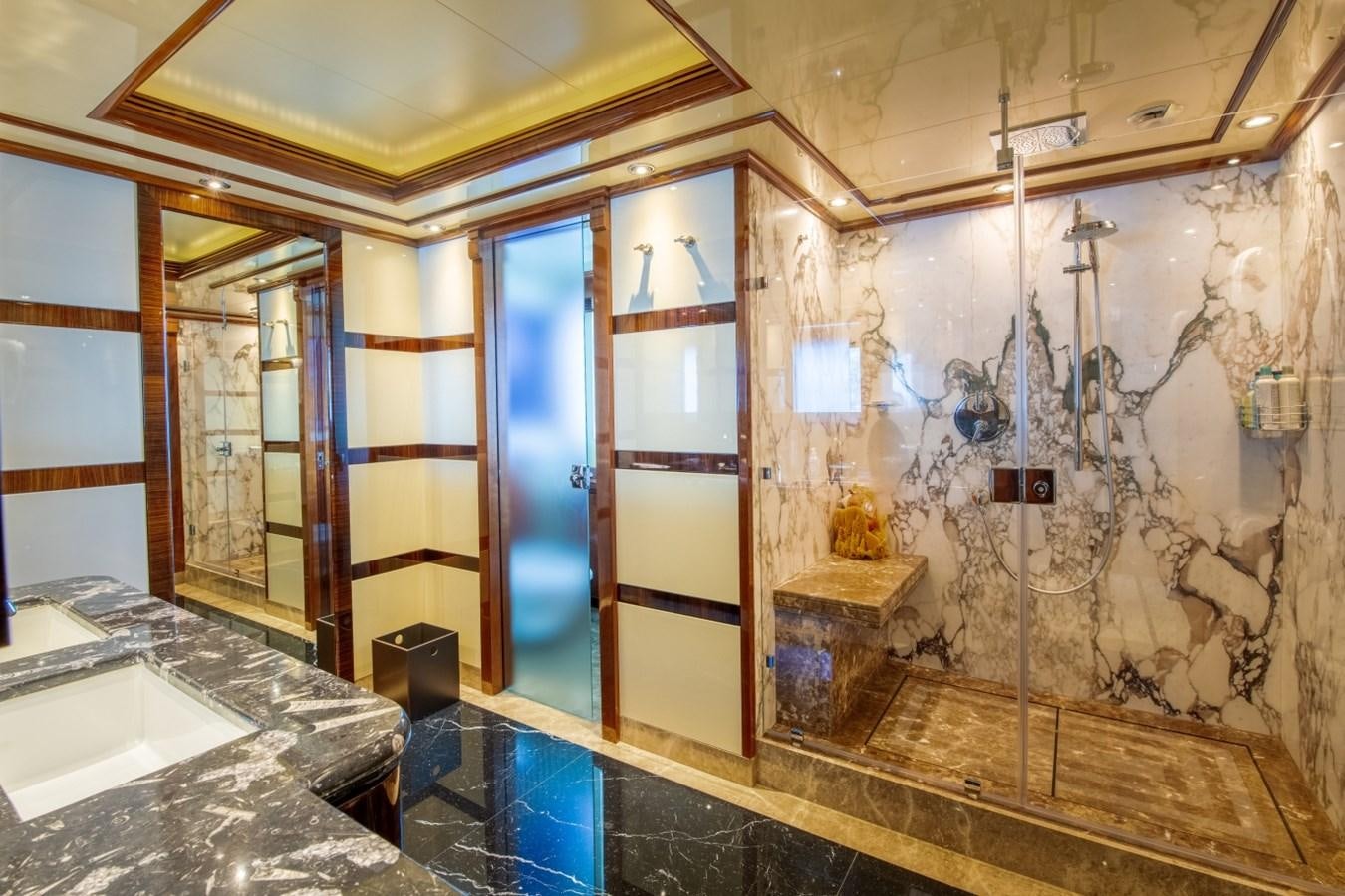 a bathroom with a large marble shower aboard ARBEMA Yacht for Charter