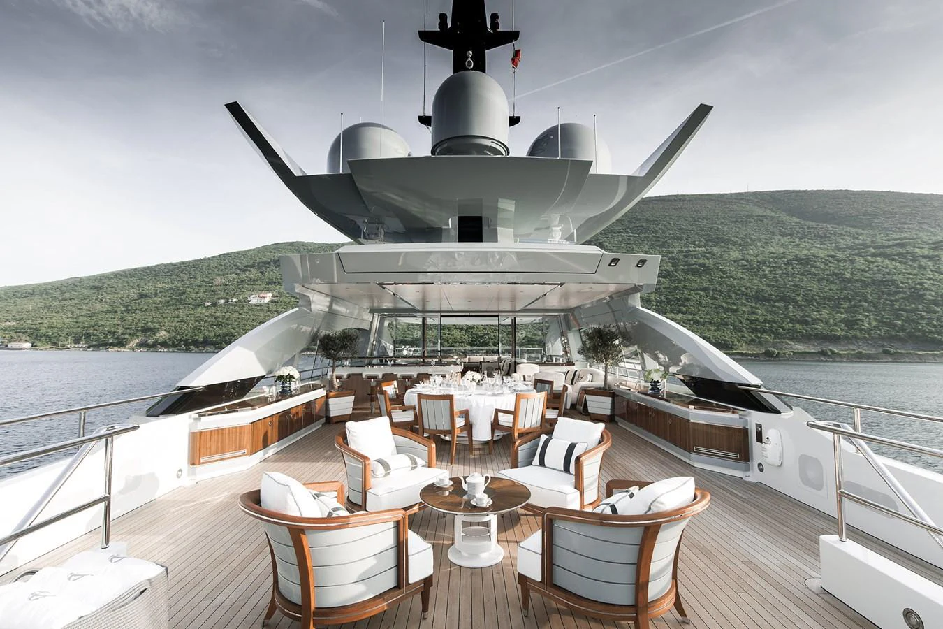a large white ship docked at a pier aboard GAJA Yacht for Sale