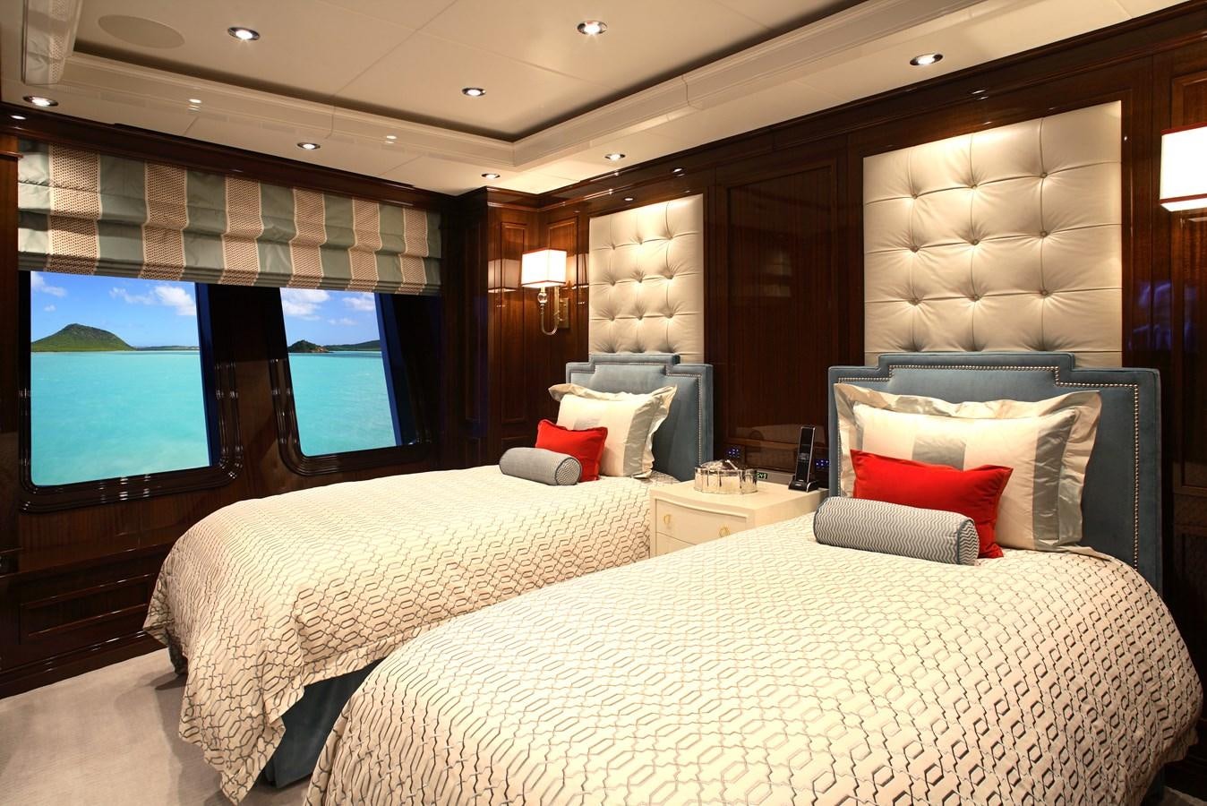 a room with a bed and a tv aboard INVICTUS Yacht for Sale