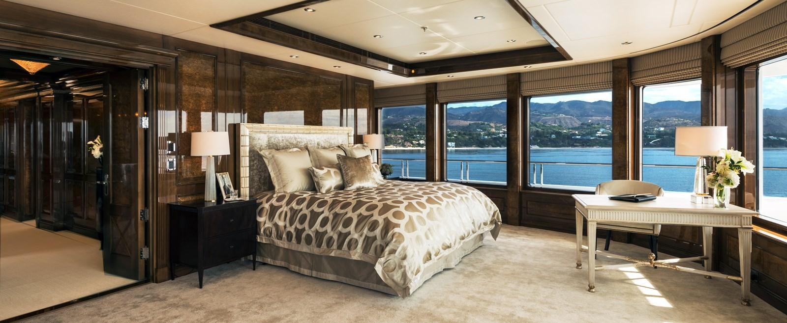 a large bedroom with a large bed aboard INVICTUS Yacht for Sale