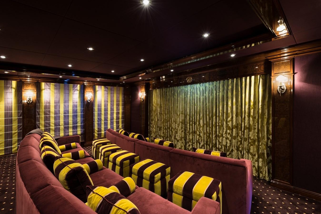 a room with a couch and a curtain aboard INVICTUS Yacht for Sale